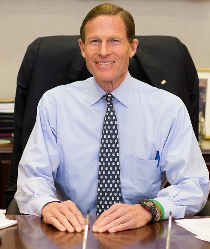 Senator Blumenthal sitting behind his desk